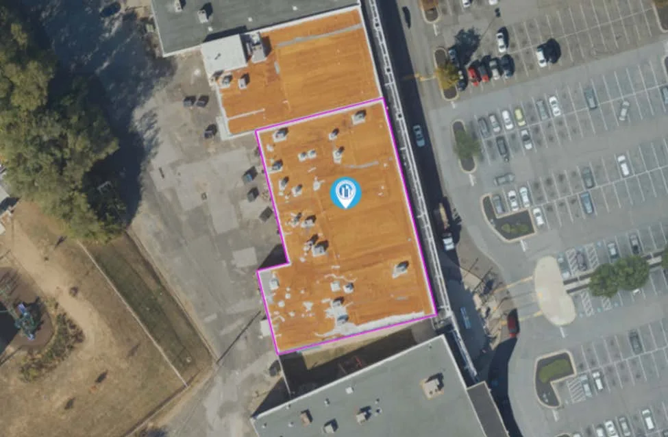 Commercial roof, worn orange surface, previous capture
